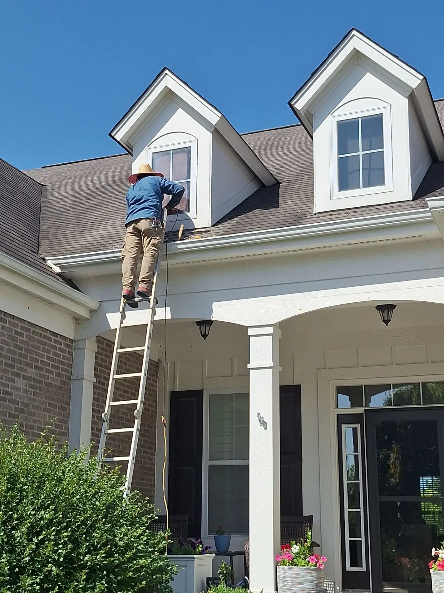 Crew completing dormer window replacement on a residential home in Fishers, Indiana