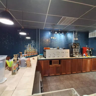 Commercial remodeling and renovation of a coffee shop with updated counters, cabinetry, and lighting in West Lafayette, Indiana.