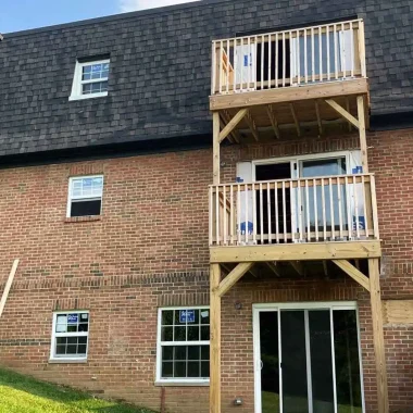 New sliding patio door and replacement windows installed on a multifamily building in Middletown, Ohio